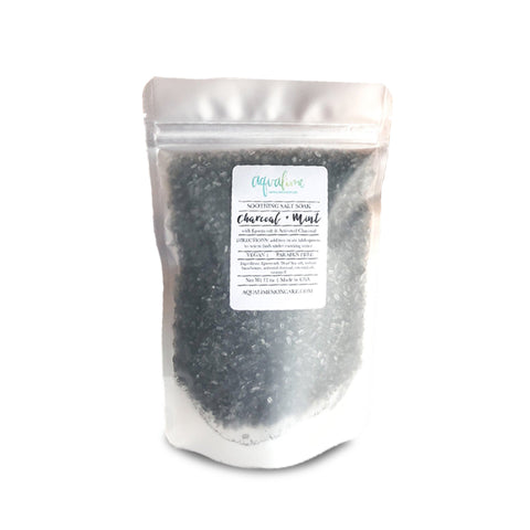 A sleek black pouch of Aqualime Charcoal & Mint Detox Soaking Salt on a white background, emphasizing its natural, detoxifying ingredients