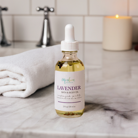 Aqualime Lavender Bath and Body Oil bottle placed on a white bathroom countertop with a soft towel, emphasizing its soothing, hydrating properties