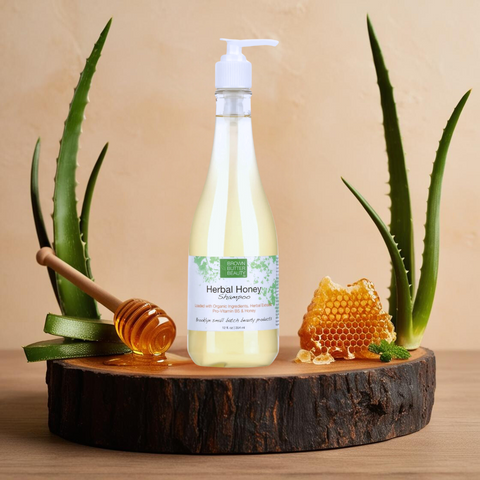 Brown Butter Beauty Herbal Honey Shampoo bottle placed on a wooden cutting board with aloe vera leaf and honey, highlighting its natural, nourishing ingredients