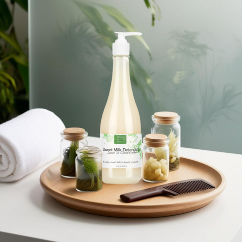 Brown Butter Beauty Detangling Leave-In Conditioner bottle on a wooden plate with a towel and hair comb, perfect for frizz control and moisture