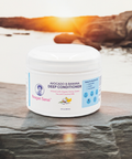 Reagan Sanai Avocado & Banana Deep Conditioner bottle placed on a rock with a fresh morning view, ideal for nourishing and moisturizing hair