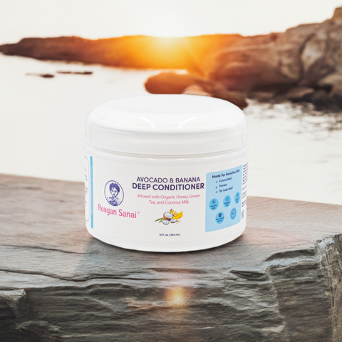 Reagan Sanai Avocado & Banana Deep Conditioner bottle placed on a rock with a fresh morning view, ideal for nourishing and moisturizing hair