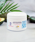 Reagan Sanai Avocado & Banana Deep Conditioner bottle on a white background with green leaf and half-cut avocado, nourishing and moisturizing hair